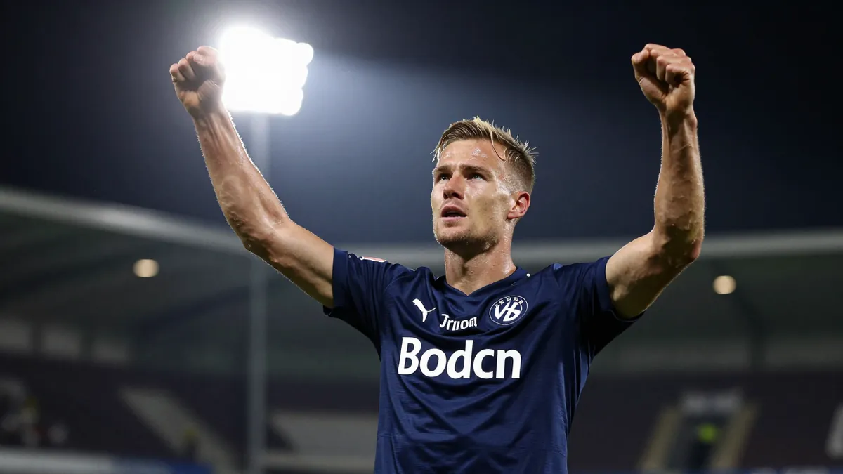 A tight action shot of a Bodø/Glimt player, mid-20s, athletic build, wearing a dark blue jersey, celebrating a goal with...