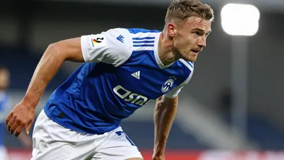 A photorealistic image of an anonymous Lillestrøm SK player, aged 20-25, wearing a blue jersey with white sleeves, and...
